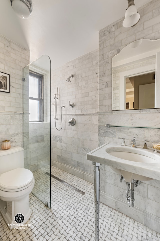 bathroom featuring tile walls, a walk in shower, toilet, and tile patterned flooring