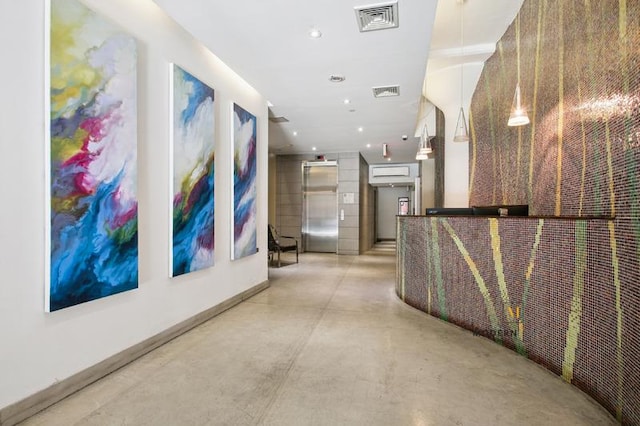 10-55 47th Ave Unit 5-E, New York City, NY 11101 - hall featuring elevator, concrete floors, and baseboards