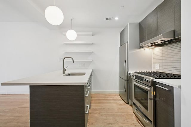 10-55 47th Ave Unit 5-E, New York City, NY 11101 - kitchen featuring stainless steel appliances, a sink, open shelves, a peninsula, and baseboards