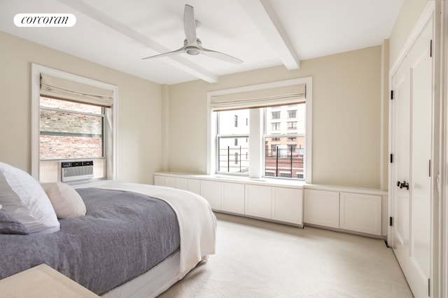 bedroom featuring beam ceiling, visible vents, cooling unit, and multiple windows