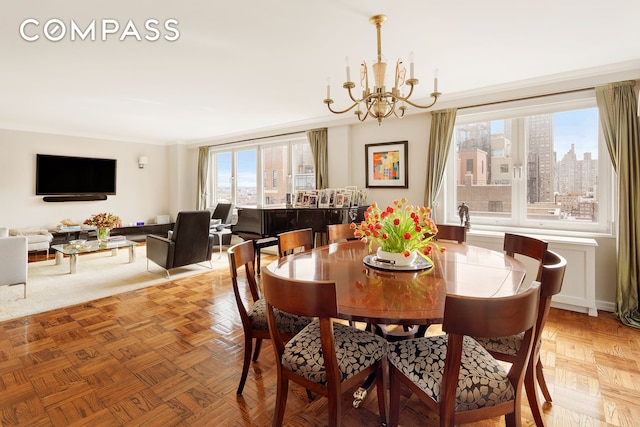 dining area featuring a view of city and a notable chandelier
