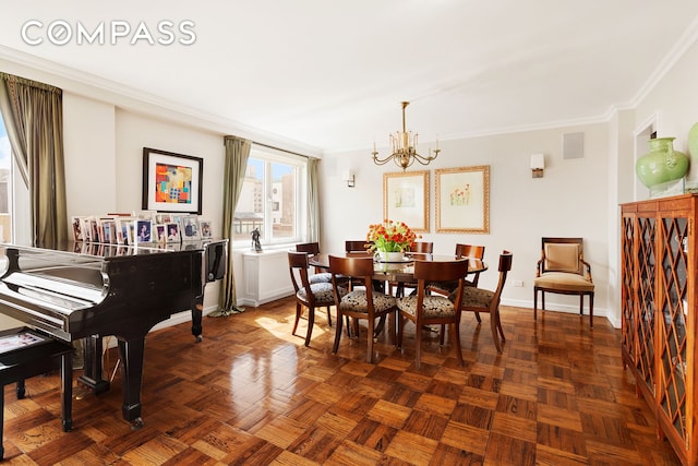 dining room featuring a notable chandelier, baseboards, crown molding, and visible vents