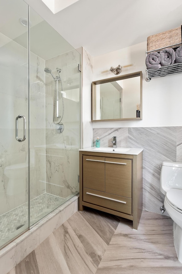 47-28 11th St Unit 6-C, New York City, NY 11101 - full bath with toilet, a marble finish shower, tile walls, and vanity