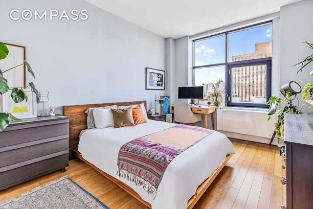 bedroom with hardwood / wood-style floors