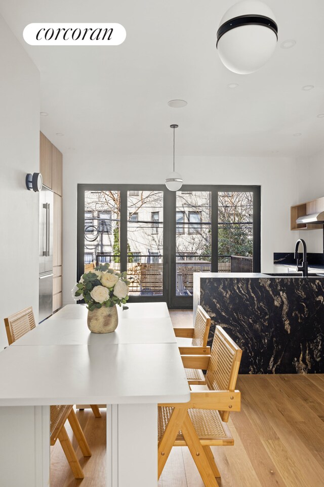 dining room with visible vents and wood finished floors