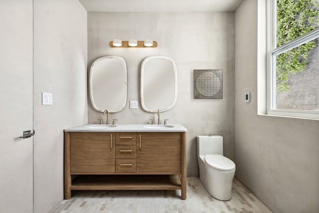 432 Fenimore St, New York City, NY 11225 - full bathroom featuring double vanity, toilet, and wood finished floors