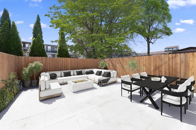 432 Fenimore St, New York City, NY 11225 - fenced backyard featuring an outdoor living space with a fire pit, a patio, and outdoor dining area