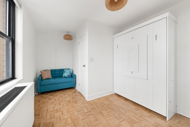 unfurnished room with baseboards