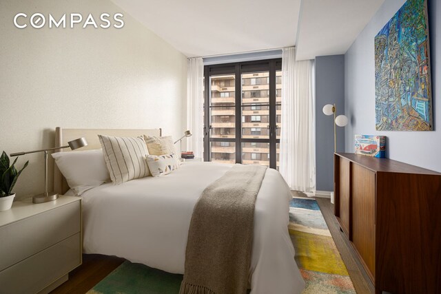 250 W 96th St Unit 11B, New York City, NY 10025 - bedroom featuring dark wood-style flooring