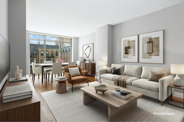 living area featuring wood finished floors and expansive windows
