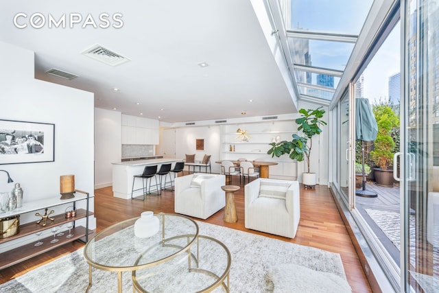 73 Worth St Pha, Pha, New York City, NY 10013 - living room with light wood-type flooring and a skylight