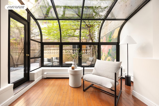 sunroom featuring a baseboard radiator