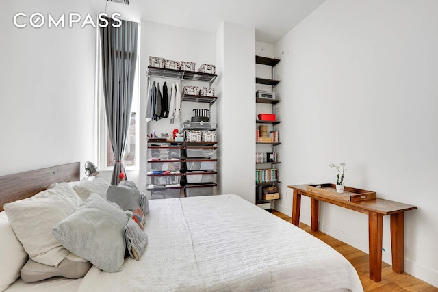 220 W 148th St Unit 3K, New York City, NY 10039 - bedroom with wood finished floors and baseboards