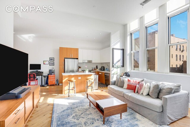 220 W 148th St Unit 3K, New York City, NY 10039 - living area with light wood-style flooring