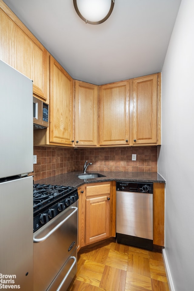230 E 15th St Unit 5J, New York City, NY 10003 - kitchen with appliances with stainless steel finishes, tasteful backsplash, and dark stone counters