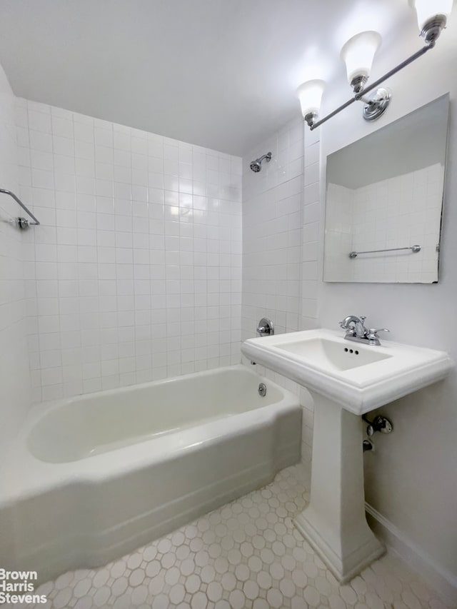 230 E 15th St Unit 5J, New York City, NY 10003 - bathroom featuring shower / washtub combination and baseboards
