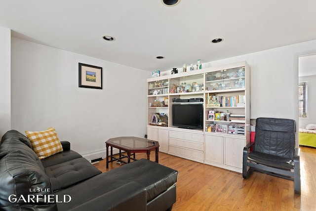 living room featuring recessed lighting and light wood-style flooring