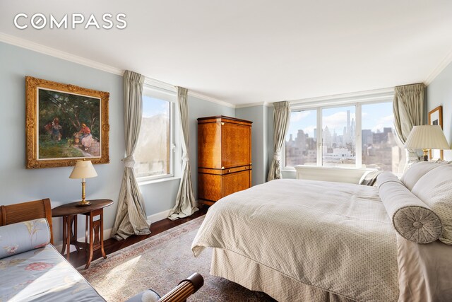 1049 5th Ave Unit 17A, New York City, NY 10028 - bedroom with baseboards, ornamental molding, wood finished floors, and a view of city