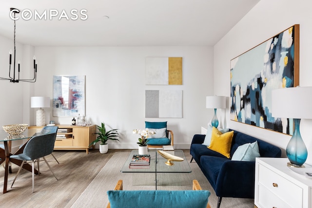 10 Nevins St Phb, Phb, New York City, NY 11217 - living area featuring wood finished floors, baseboards, and a chandelier