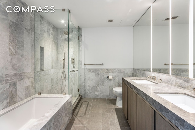 10 Nevins St Phb, Phb, New York City, NY 11217 - bathroom with toilet, a stall shower, tile walls, a bath, and double vanity