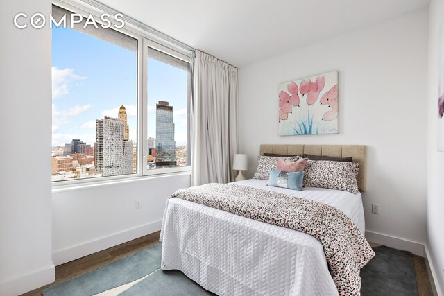 10 Nevins St Phb, Phb, New York City, NY 11217 - bedroom featuring multiple windows, baseboards, and wood finished floors