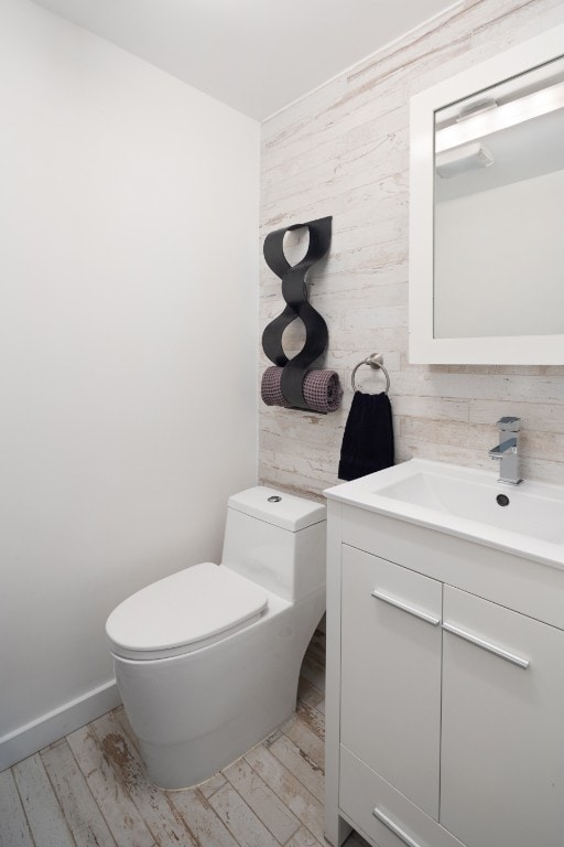 41 Wolcott Street House, New York City, NY 11231 - bathroom featuring toilet, vanity, wood finished floors, and tile walls