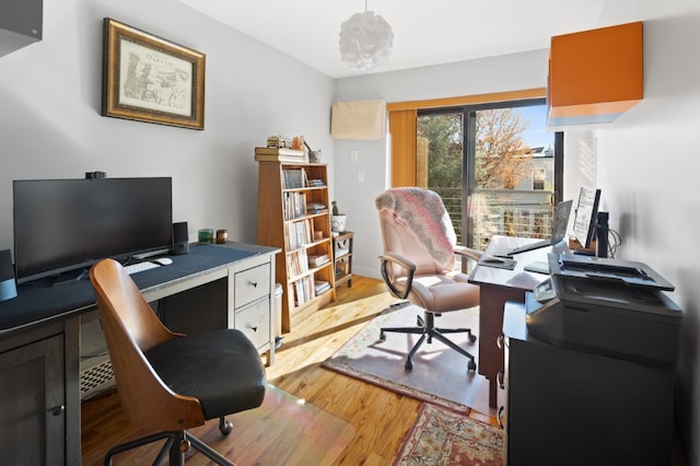 41 Wolcott Street House, New York City, NY 11231 - home office with light wood-style flooring and baseboards