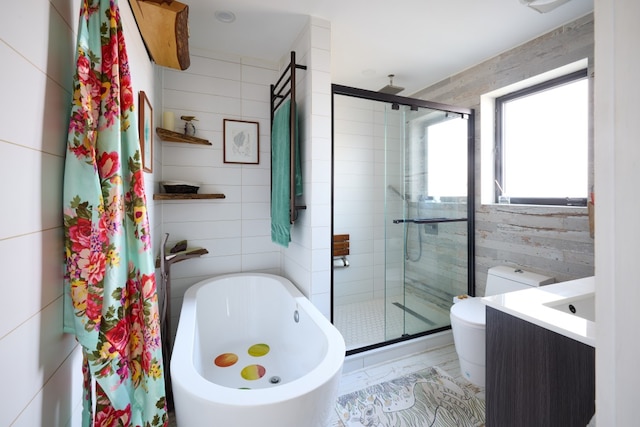41 Wolcott Street House, New York City, NY 11231 - bathroom with a stall shower, a freestanding tub, toilet, marble finish floors, and tile walls