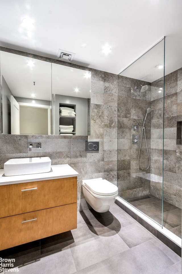 41 E 28th St Unit 2B, New York City, NY 10016 - full bath with tile walls, a walk in shower, vanity, and toilet