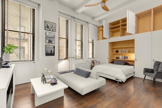 bedroom with dark wood-style flooring and beam ceiling