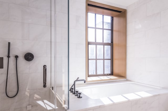36 Bleecker St Unit 4A, New York City, NY 10012 - full bath with a stall shower, a bath, and tile walls