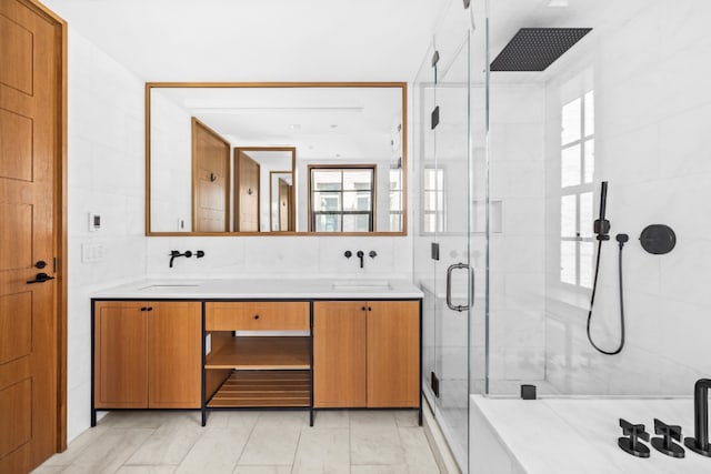 36 Bleecker St Unit 4A, New York City, NY 10012 - full bathroom with a shower stall, double vanity, and tile walls