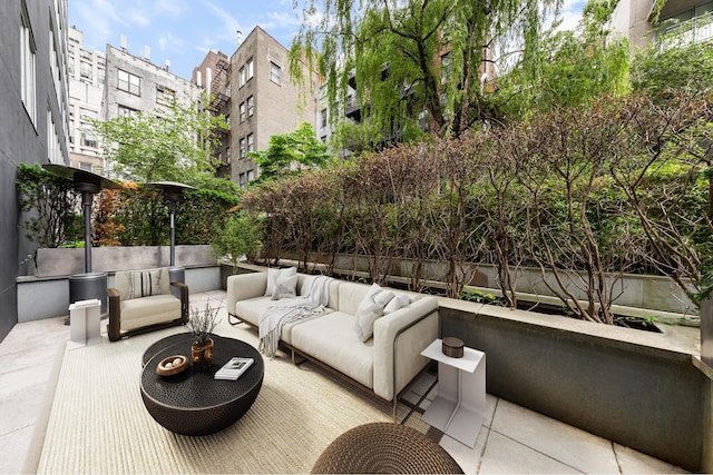 view of patio / terrace with an outdoor living space and fence