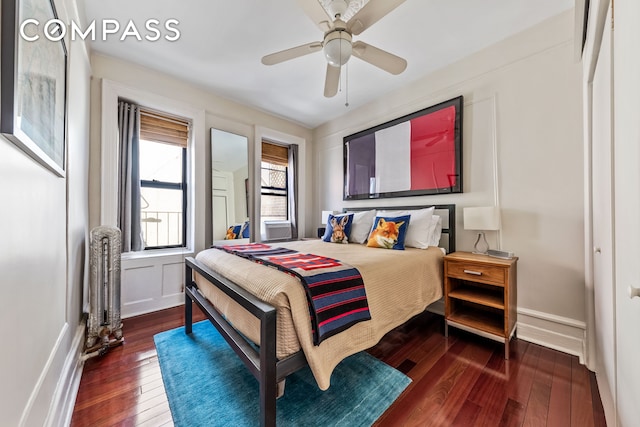 411 W 44th St Unit 13, New York City, NY 10036 - bedroom featuring wood-type flooring, ceiling fan, and baseboards
