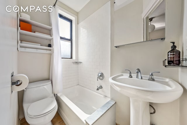 411 W 44th St Unit 13, New York City, NY 10036 - bathroom with toilet, shower / bath combo, and a sink
