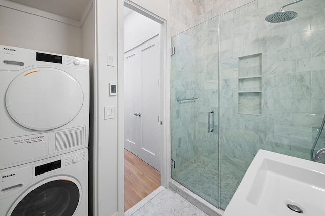washroom with estacked washer and dryer