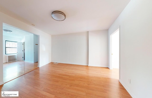 interior space with light wood-style floors and baseboards