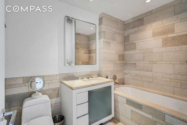 450 E 83rd St Unit 6B, New York City, NY 10028 - full bath featuring a bath, tile walls, vanity, toilet, and recessed lighting