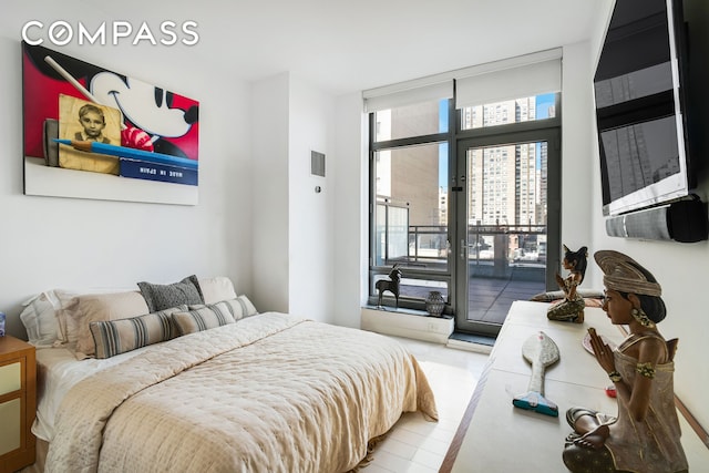 450 E 83rd St Unit 6B, New York City, NY 10028 - bedroom featuring access to outside and expansive windows