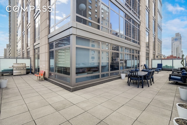 450 E 83rd St Unit 6B, New York City, NY 10028 - view of patio / terrace with a city view and grilling area