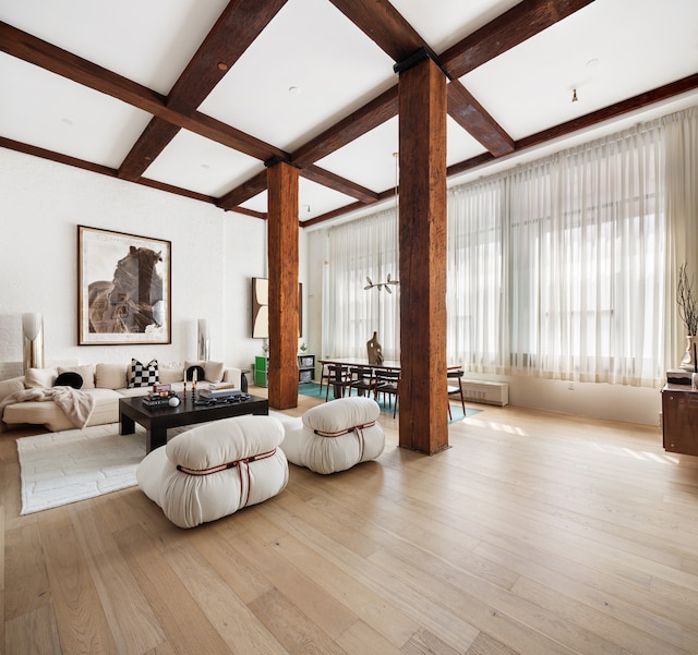 62 Beach St Tha, Unit Tha, New York City, NY 10013 - living area featuring coffered ceiling, plenty of natural light, beam ceiling, and wood-type flooring