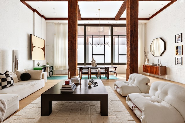 62 Beach St Tha, Unit Tha, New York City, NY 10013 - living area featuring wood finished floors, ornamental molding, and a chandelier