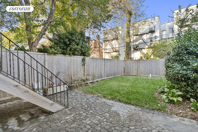 view of yard with a fenced backyard and a patio