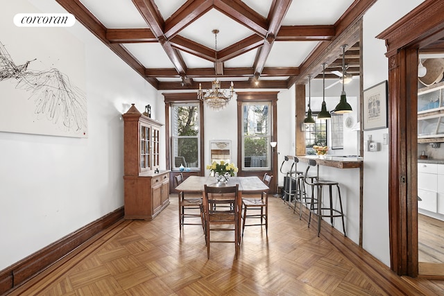 dining room with coffered ceiling, visible vents, beam ceiling, baseboards, and a notable chandelier