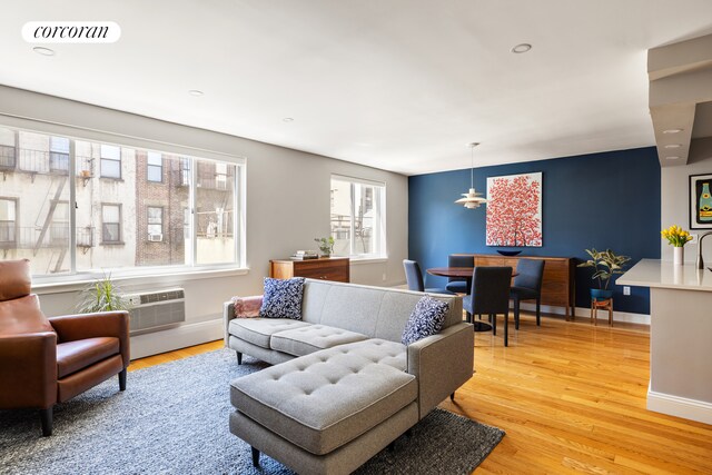 416 E 11th St Unit 4A, New York City, NY 10009 - living room with light wood-style floors, recessed lighting, and baseboards