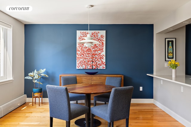 416 E 11th St Unit 4A, New York City, NY 10009 - dining room featuring wood finished floors and baseboards