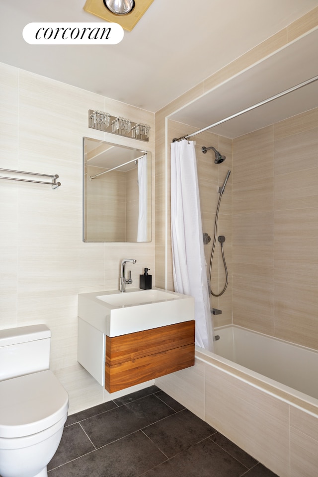 416 E 11th St Unit 4A, New York City, NY 10009 - full bath featuring tile patterned flooring, tile walls, vanity, toilet, and tiled shower / bath combo