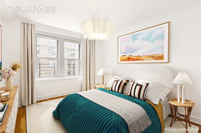16 E 98th St Unit 7F, New York City, NY 10029 - bedroom with wood finished floors, crown molding, and baseboards