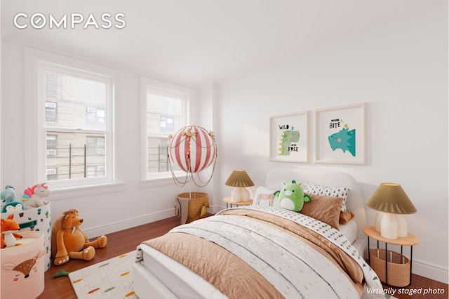 16 E 98th St Unit 7F, New York City, NY 10029 - bedroom featuring multiple windows, wood finished floors, and baseboards