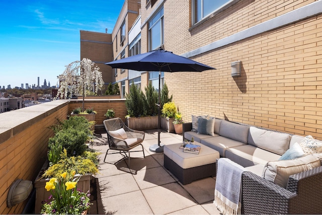 view of patio featuring outdoor lounge area and a skyline view